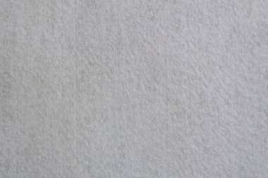 Süet ya da kumaştan doğal beyazın yakın çekim dokusu. Kumaş arka plan olarak. Tasarım için parlak malzeme.