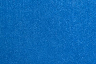 Mavi desenli süet ya da kadife kumaş yakın plan. Doğal ya da yapay dikiş malzemesi. Tasarım için arkaplan olarak kumaş.