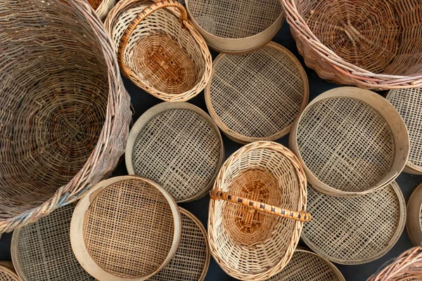 Set of various empty wicker baskets and sieves. Shop baskets of different kinds. Various retro kitchenware.