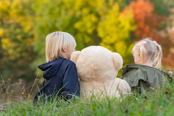 Blond Brother Sister Sit Clearing Large Teddy Bear Siblings Autumn — Stock Photo, Image