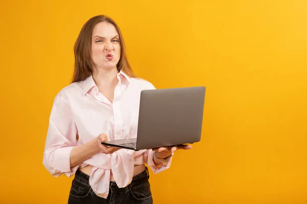 Caucasian Woman Holds Laptop Makes Face Girl Disgruntled Expression Her — Stock Photo, Image