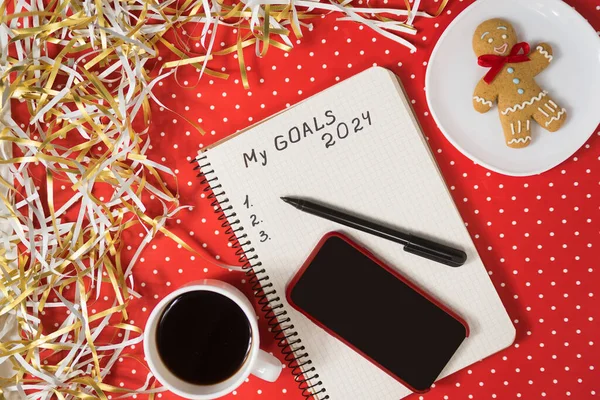Phrase Goals 2024 Notebook Black Pen Smart Phone Gingerbread Coffee Stock Photo