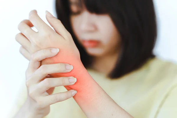 Wrist pain in the young women or diseases related to rheumatism, office syndrome, exercise. Concept of health problems.