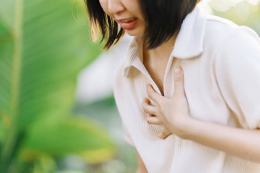 Women experience chest congestion due to suffocation. Health care concept.