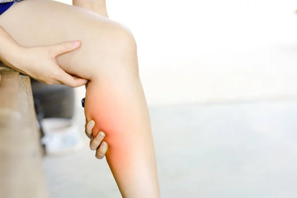 A woman\'s calf pain due to exercise. Health care concept.