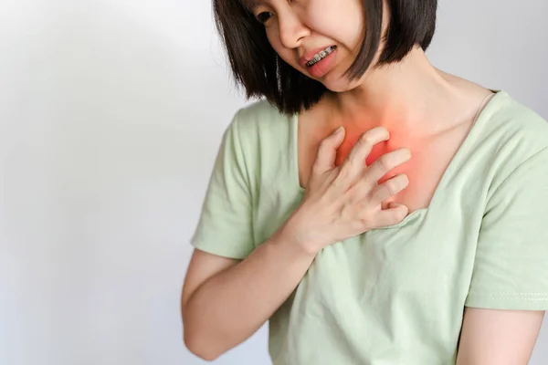 Asian woman chest pain on white background.