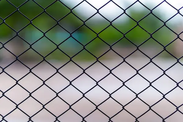 stock image Close up chain link fence with blurred background