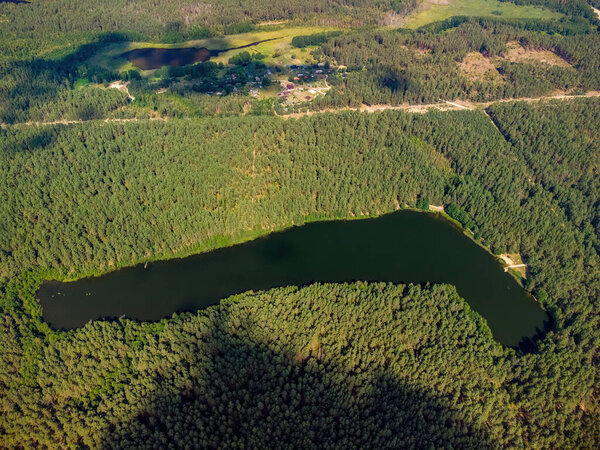 Aerial view of a lake in the forests of Lithuania, wild nature. The name of the lake is 