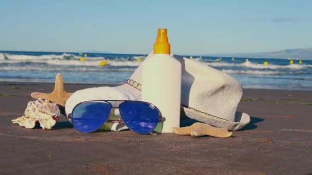 Summer Background Sun Cream Shells Sunglases Summer Hat Starfish Sandy — Stock Video
