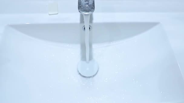 Clean Water Flows Faucet White Bathroom Sink Close Top View — Stock Video