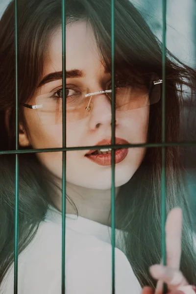 Close Portrait Woman White Blause Green Metal Grid — Stock Photo, Image