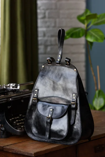 Black Shiny Leather Casual Backpack Wooden Table Indoor Photo — Stock Photo, Image