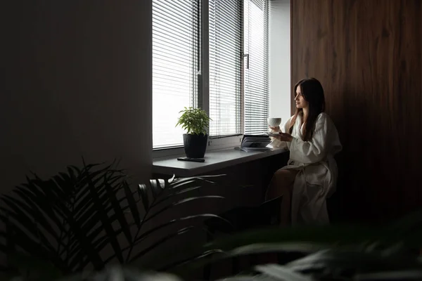 woman drinking coffee in the morning at home. Beautifull morning at cozy home.