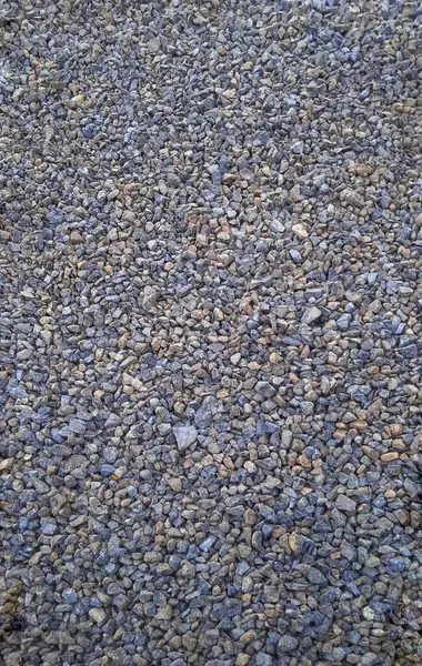 Yakın mesafeden ezilmiş kaya. Parçalanmış taş yol inşaatı materyal çakıl dokusu