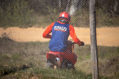 Perigueux france april 9 2023 : motocross on the dirty ground clipart