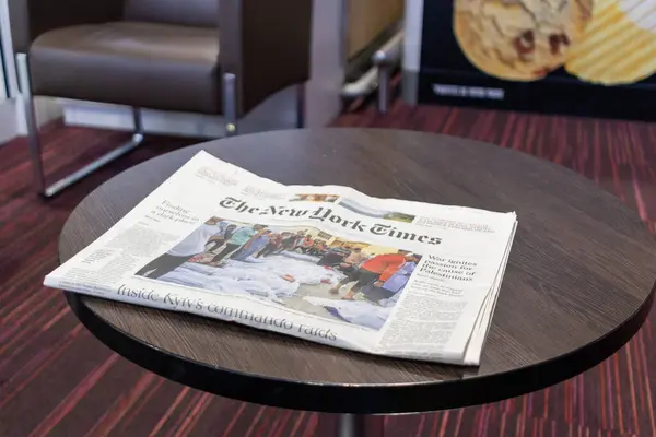 stock image Ile de France, France October 24, 2023: News at Hand - The New York Times Newspaper on a Table