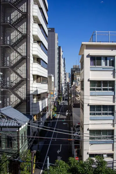 stock image Tokyo, Japan, 26 October 2023: Alleyway with Electrical Wires Between Apartment Buildings