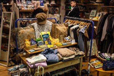 Tokyo, Japan, 26 October 2023: Vintage Clothing and Accessories Display in Local Boutique clipart