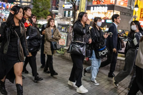 stock image Tokyo, Japan, 27 October 2023: Group of people walking in Tokyo at night