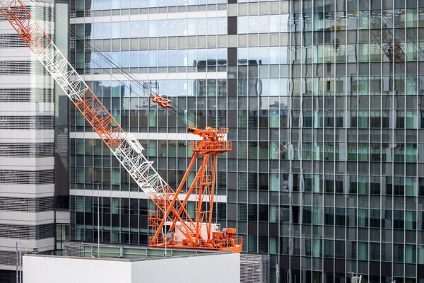 Tokyo, Japan, 29 October 2023: Tower crane on a modern building construction site