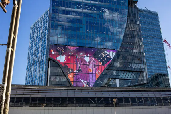 stock image Tokyo, Japan, 29 October 2023: Modern building in Tokyo displaying a large LED screen advertisement