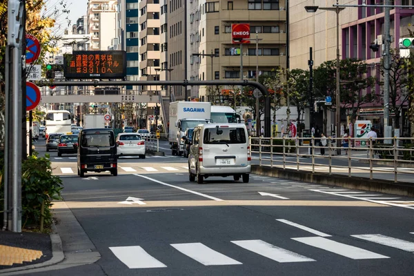 stock image Tokyo, Japan, 1 November 2023: Delivery trucks navigating through the busy streets of Tokyo