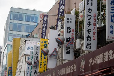 Tokyo, Japan, 6 November 2024: Urban Streetscape with Japanese Signboards clipart