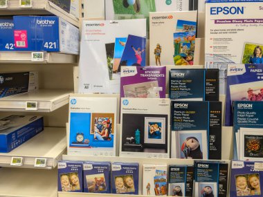 France, 2 March 2024: Various Brands of Photo Paper and Office Supplies on Store Shelves clipart