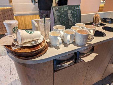 France, 3 March 2024: Unfinished Starbucks Coffee on Counter clipart