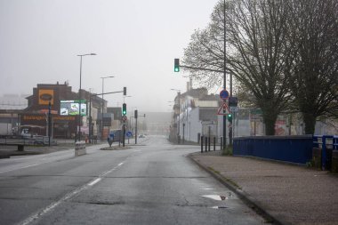 France, 30 March 2024: Misty Morning in Urban Street clipart
