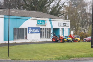 France, 30 March 2024: Lawnmower and Agricultural Equipment Storefront clipart