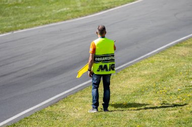 France, 14 April 2024: Motorsport Event Staff Overseeing Track clipart
