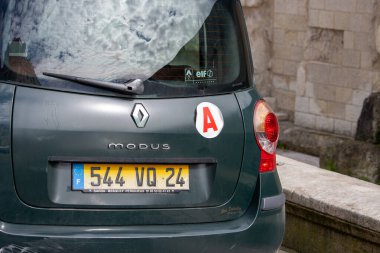 France, 10 March 2024: Rear view of Renault Modus car parked in urban setting clipart