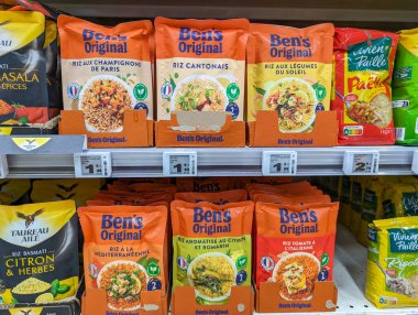 France, 11 March 2024: Variety of Ben's Original Rice Products on Supermarket Shelf clipart