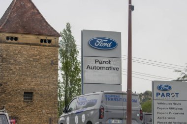 France, 07 April 2024: Ford Parot Automotive signage in front of a stone building. clipart