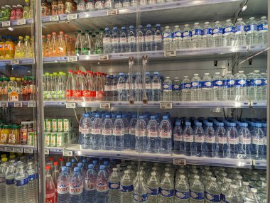 France, 31 March 2024: Bottled water selection on supermarket shelves clipart