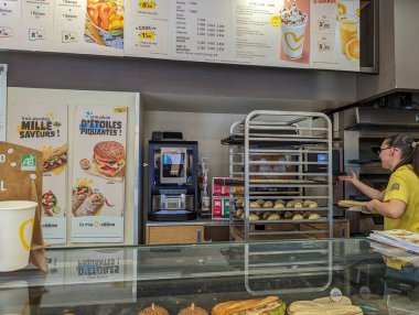 France, 11 May 2024: La Mie Caline Bakery Counter with Fresh Pastries and Sandwiches clipart