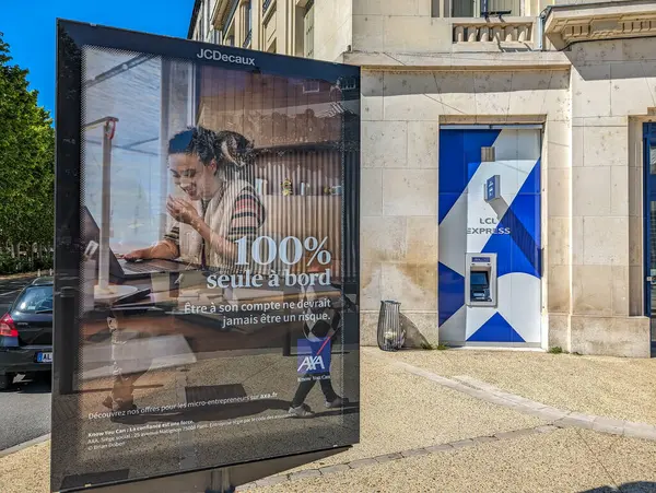 stock image France, 9 May 2024: AXA Advertisement at Bus Stop in French City
