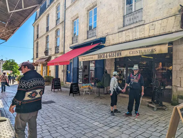 stock image France, 9 May 2024: Tourists Exploring Historic Shopping Street