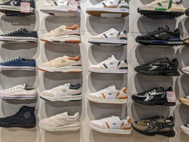 France, 08 May 2024: Display of various sneakers in a shoe store clipart
