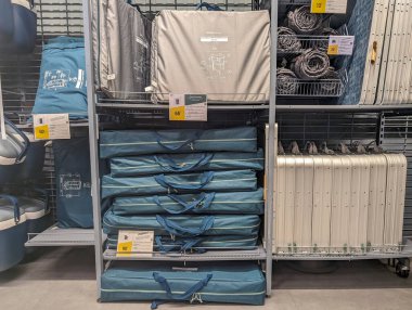 France, 09 May 2024: Store shelves with camping and outdoor gear clipart