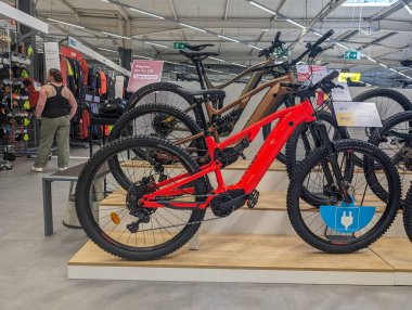France, 09 May 2024: Display of mountain bikes in a sports store clipart