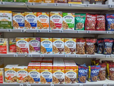 France, May 8, 2024: Assortment of Breakfast Cereals on Supermarket Shelves clipart