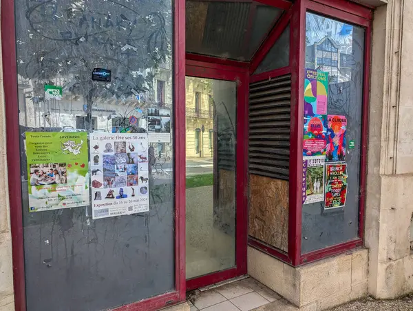 stock image France, 23, June, 2024: Old storefront with posters and advertisements
