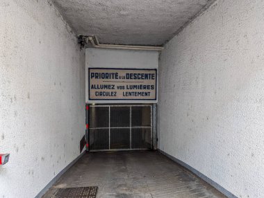 France, 19 May 2024: View of underground parking entrance with warning sign in French clipart