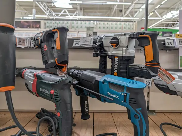 stock image France, 13 July 2024: Power tools display with Metabo and Makita drills in hardware store