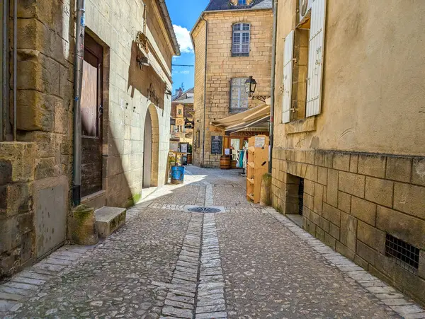 stock image France, 7 July 2024: Narrow cobblestone street in historic European village