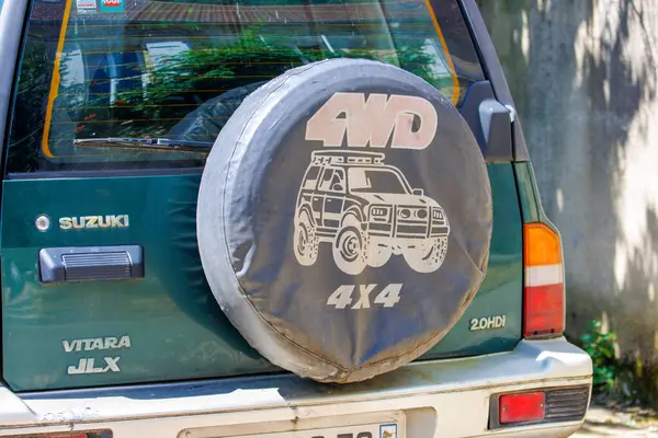 stock image France, 1 July 2024: Close-up of a Suzuki Vitara JLX 4x4 with a spare tire cover featuring an AWD logo