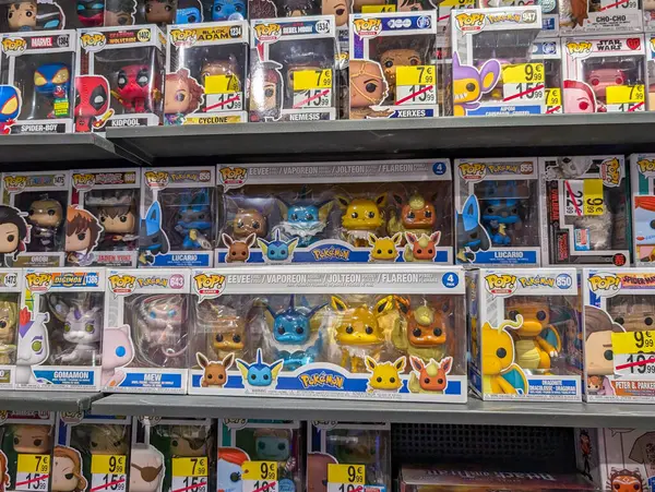 stock image France, 19 August 2024: Display of Pokemon and Funko Pop figures on store shelf