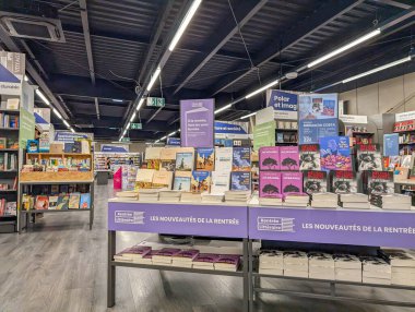 France, 19 August 2024: Back-to-school book display in a bookstore featuring new releases clipart